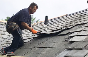 Mario Contracting removing old slate from roof