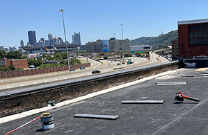 Mario Contracting doing repairs on a rubber roof