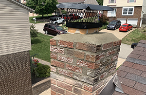 Mario contracting repointed this chimney, repaired the cap, and installed a vent guard.