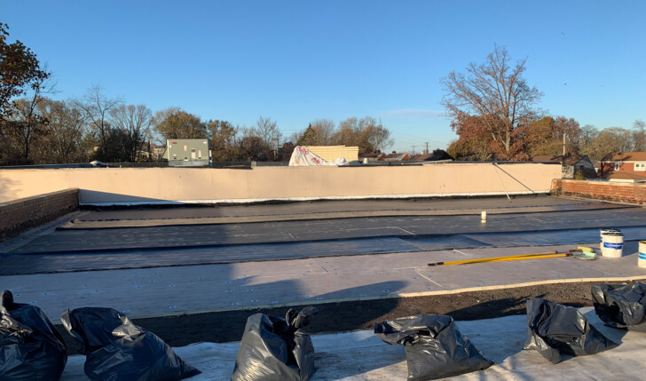 Mario Contracting installing a rubber roof.