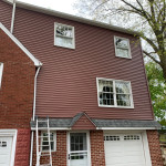 Photo of roof, gutters, downspouts, and siding project